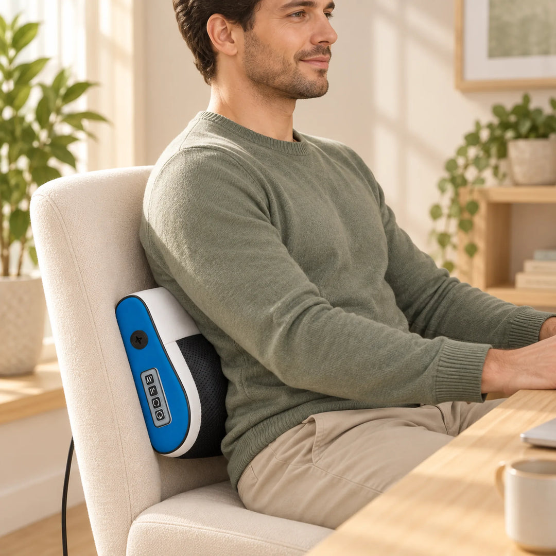 Blue shiatsu massage pillow positioned at the lower back on a chair