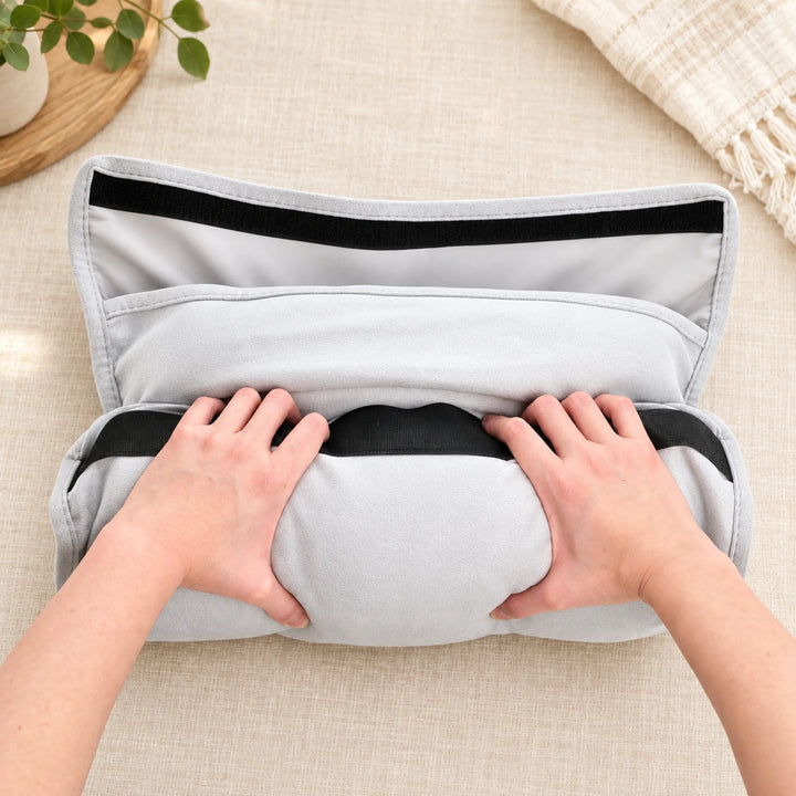 Compact travel pillow — packing into its wrap pouch