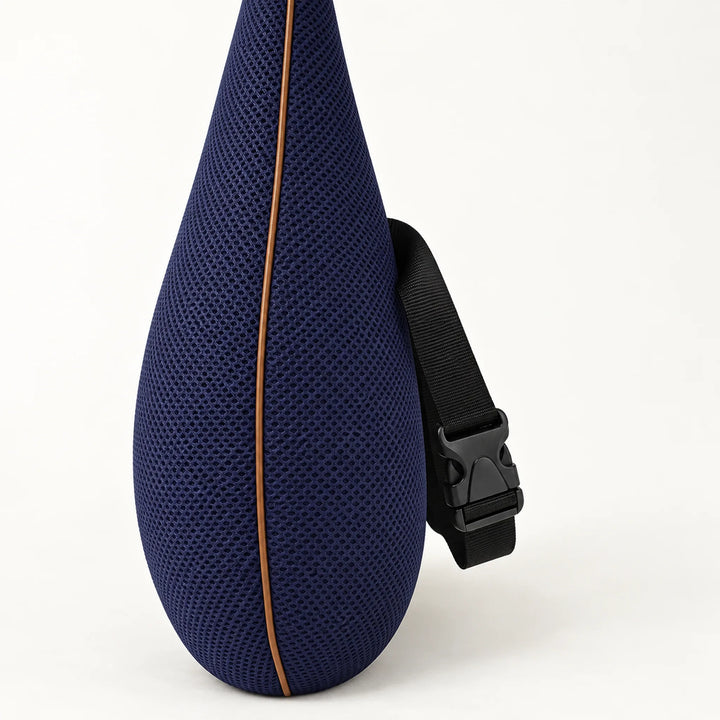 Blue lumbar cushion showing the side profile, mesh cover and adjustable buckle strap