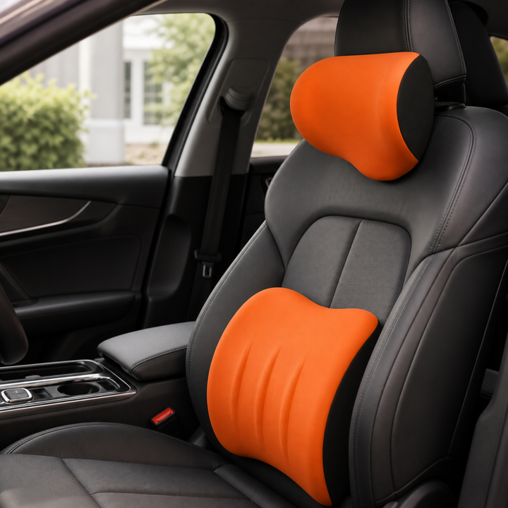 Orange headrest and lumbar support cushion set installed in a car seat